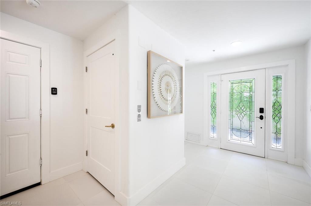888 10th Street South, Unit 101 Naples, FL 34102 - Photo 5 of 44 a view of an empty room with a window