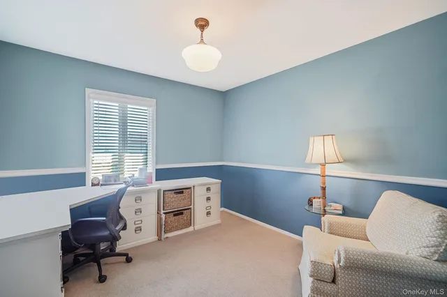 a workspace with furniture and a window