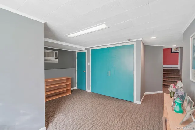 a view of room with stairs and wooden floor