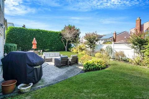 a view of a garden with an outdoor seating