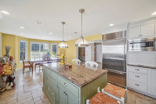 a kitchen with counter space cabinets and appliances