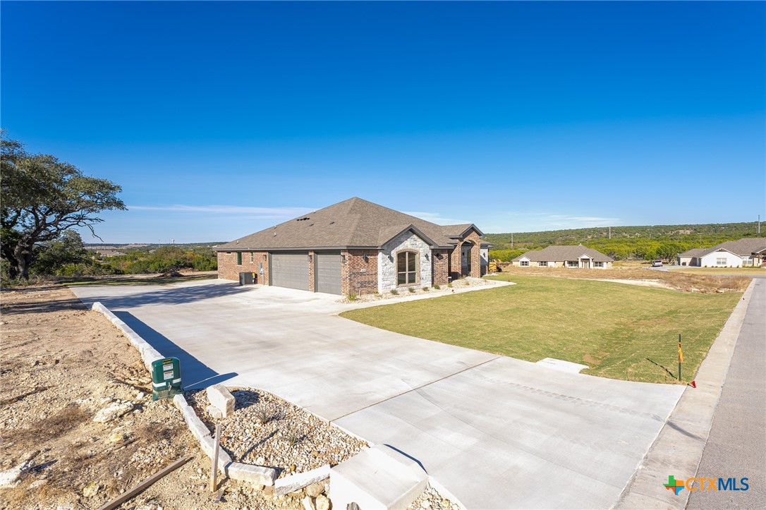 4249 Cold Springs Road Kempner, TX 76539 - Photo 46 of 48 Extra wide driveway with retaining wall