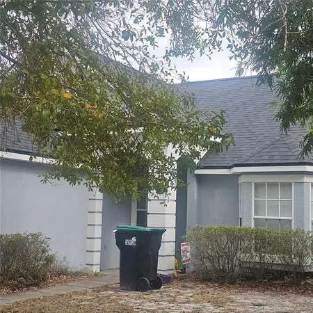 a view of a house with a tree