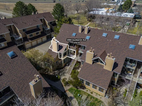 an aerial view of residential houses with outdoor space