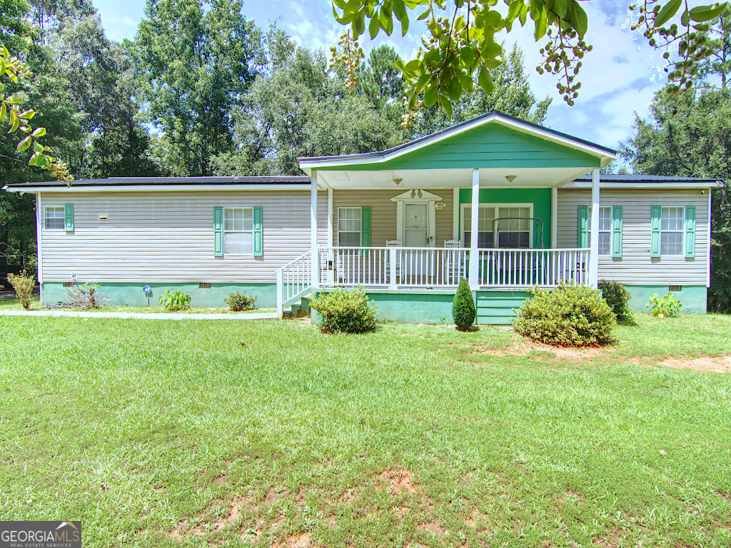 235 Buddy Faust Road Crawford, GA 30630 - Photo 1 of 1 a front view of a house with a yard