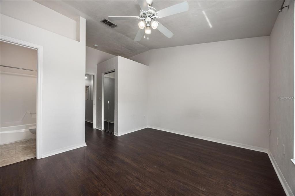 3510 Southwest 30th Way, Unit 158 Gainesville, FL 32608 - Photo 27 of 27 a view of an empty room with wooden floor