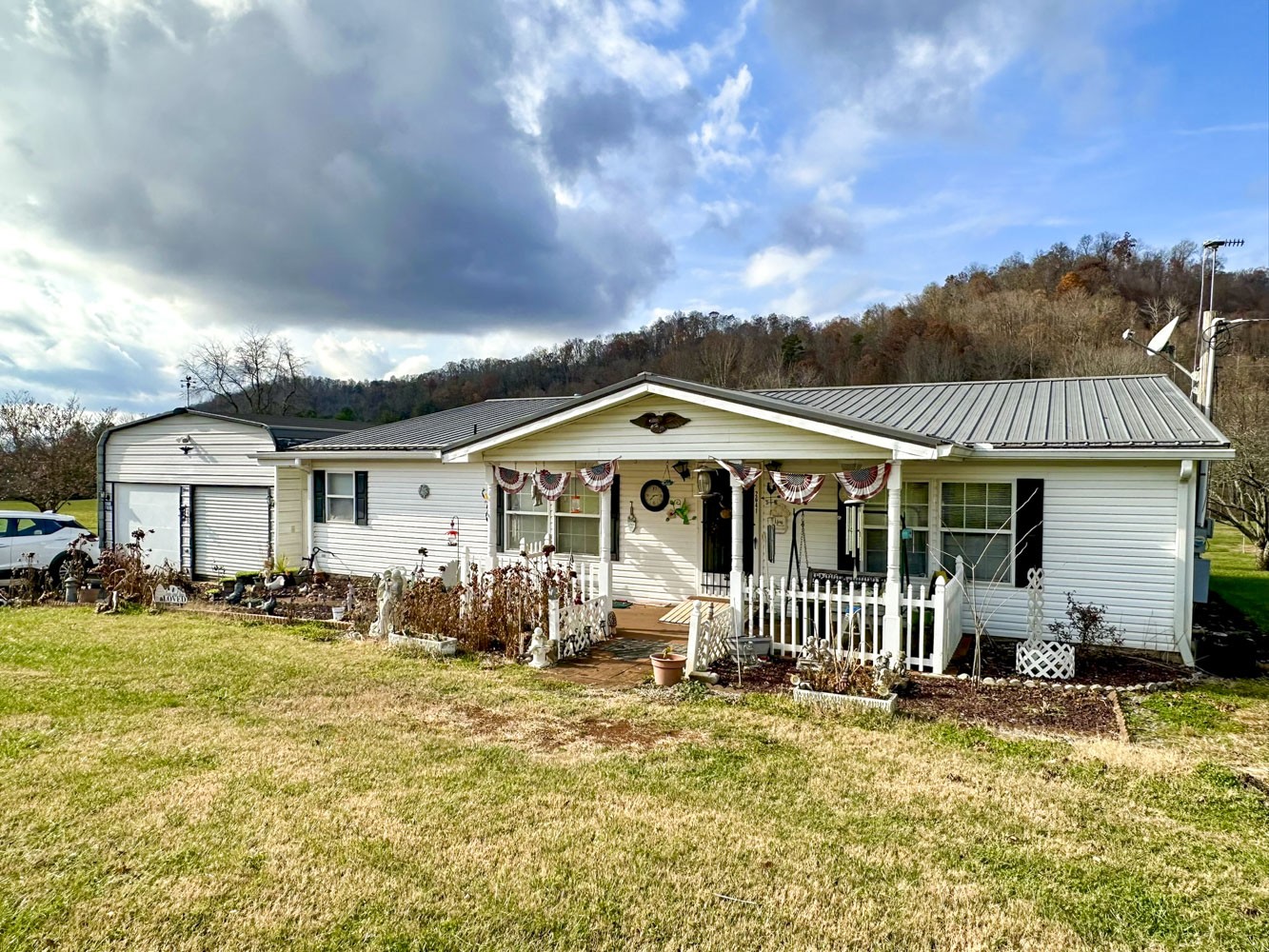 2641 Stanley Valley Road Surgoinsville, TN 37873 - Photo 3 of 26 a front view of a house with garden