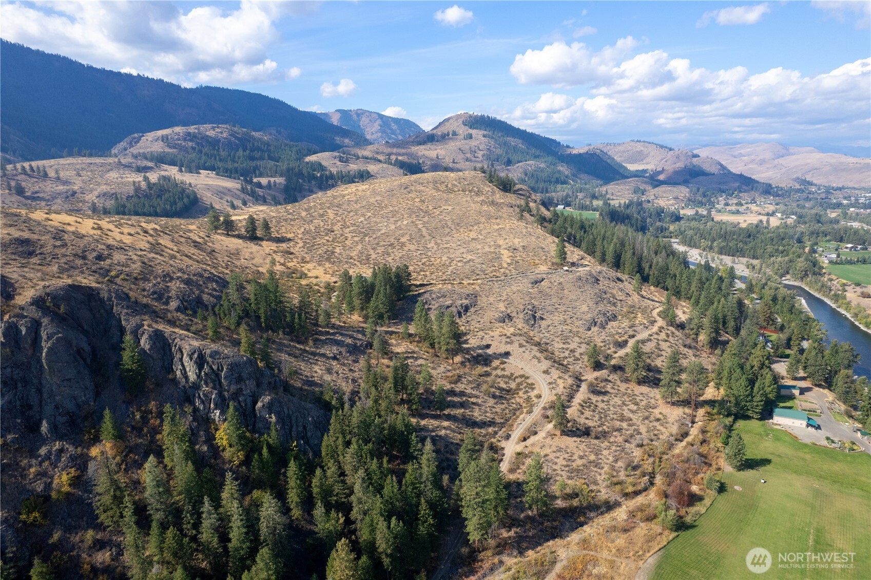 803 D Twisp Carlton Road Twisp, WA 98856 - Photo 16 of 16 a view of a houses with a yard