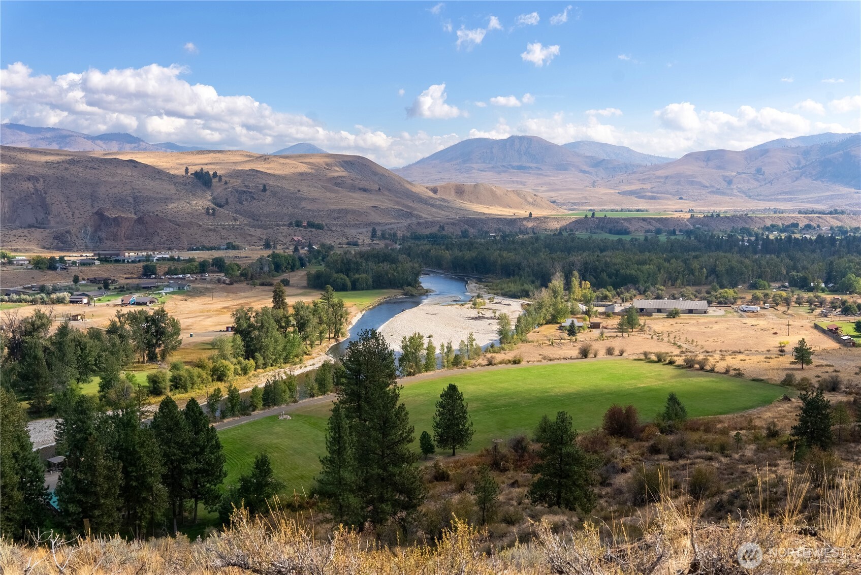 803 D Twisp Carlton Road Twisp, WA 98856 - Photo 9 of 16 a view of a lake with a mountain in the background