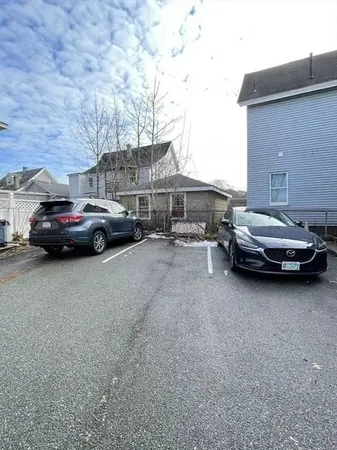 a view of street with parked cars