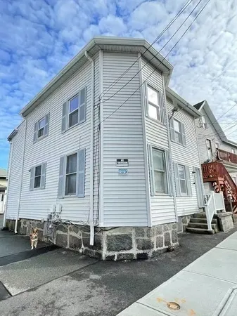 a front view of a house with a garage