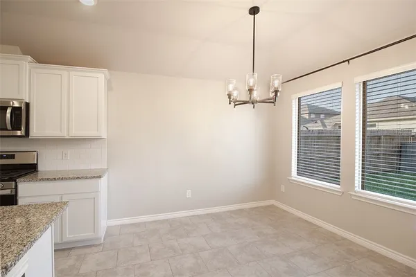 a view of a kitchen with furniture and window