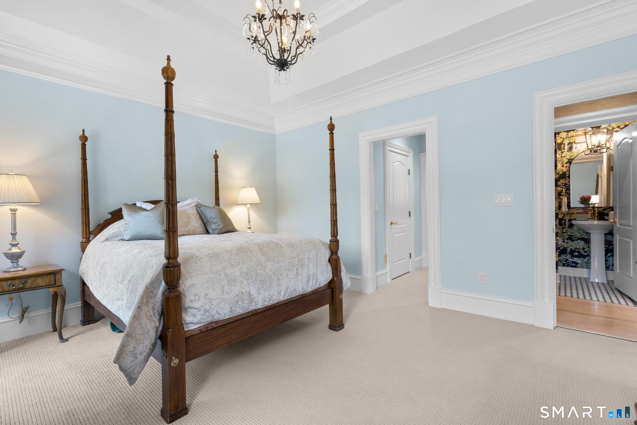130 Stillson Road, Unit 130 Fairfield, CT 06825 - Photo 15 of 38 Primary bedroom on main level with walk-in-closet and updated ensuite bath
