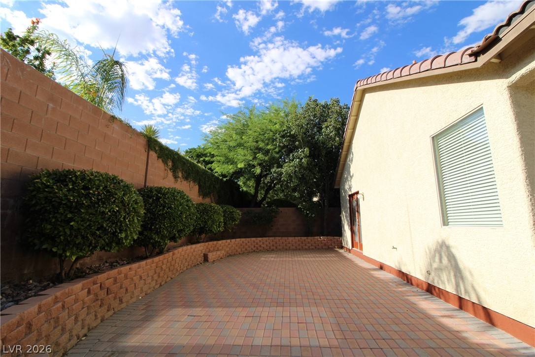 754 Rise Canyon Drive Henderson, NV 89052 - Photo 31 of 34 A private paved courtyard provides a serene outdoor space, perfect for tranquil moments.