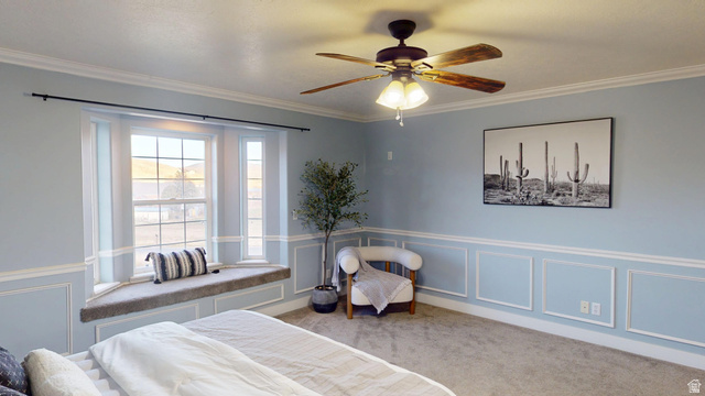9029 North Treasureton Road Preston, ID 83263 - Photo 10 of 31 Bedroom with a decorative wall, wainscoting, ornamental molding, a ceiling fan, and carpet flooring