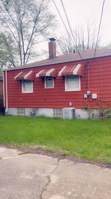 336 West Wilson Street Gary, IN 46404 - Photo 7 of 15 a front view of a house with a garden