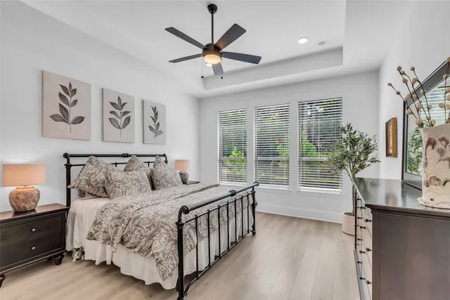 a bedroom with a large bed and a window