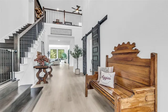 a view of entryway livingroom and hall with wooden floor