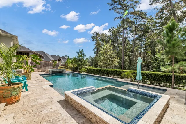 a view of a swimming pool with a lounge chairs