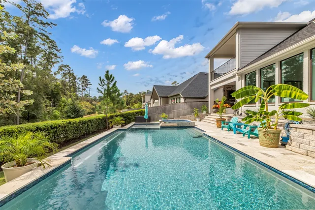 a view of swimming pool with a patio