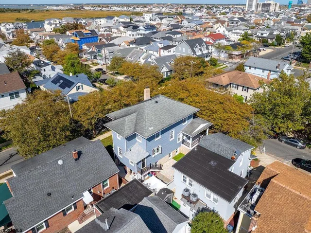 an aerial view of a house with a outdoor space