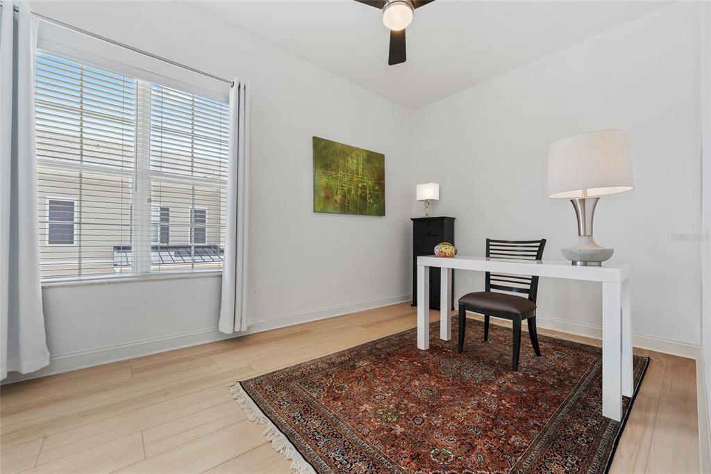 1819 Common Way Road, Unit 203 Orlando, FL 32814 - Photo 21 of 23 a view of a workspace with furniture and a window