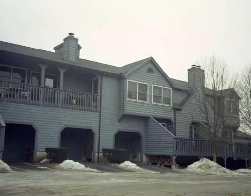 103 Fawn Ridge Lane, Unit 103 Norwalk, CT 06851 - Photo 1 of 1 a front view of a house with a yard