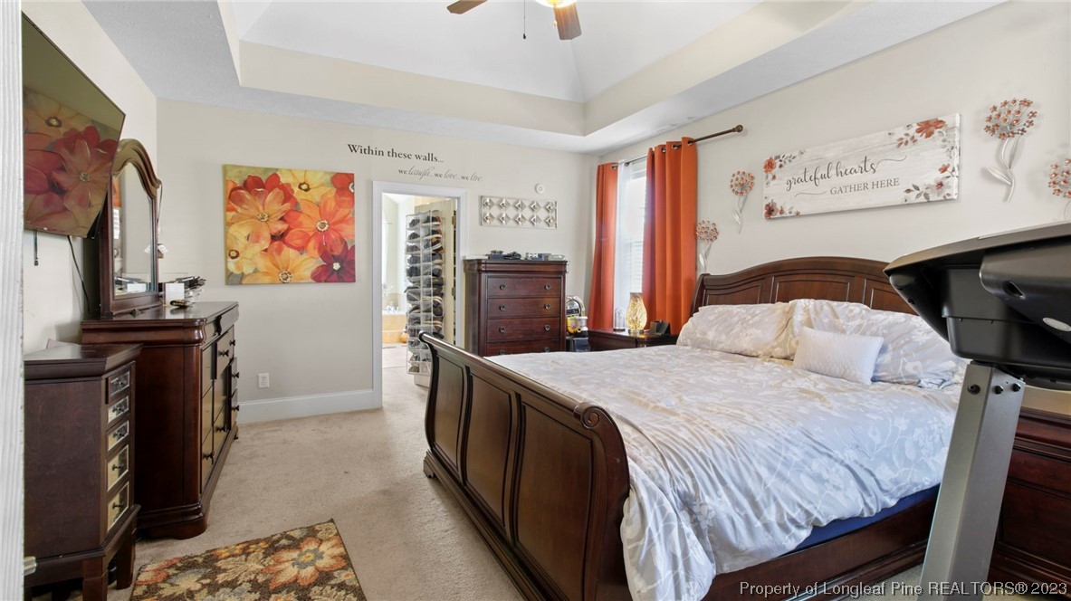 517 St Thomas Road Fayetteville, NC 28311 - Photo 11 of 47 a bedroom with a bed and a flat screen tv