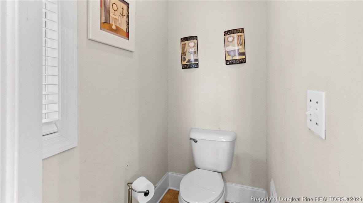 517 St Thomas Road Fayetteville, NC 28311 - Photo 16 of 47 a white toilet sitting next to a white wall