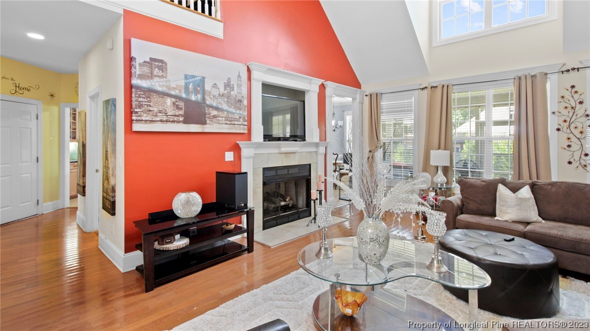 517 St Thomas Road Fayetteville, NC 28311 - Photo 18 of 47 a living room with furniture and a fireplace