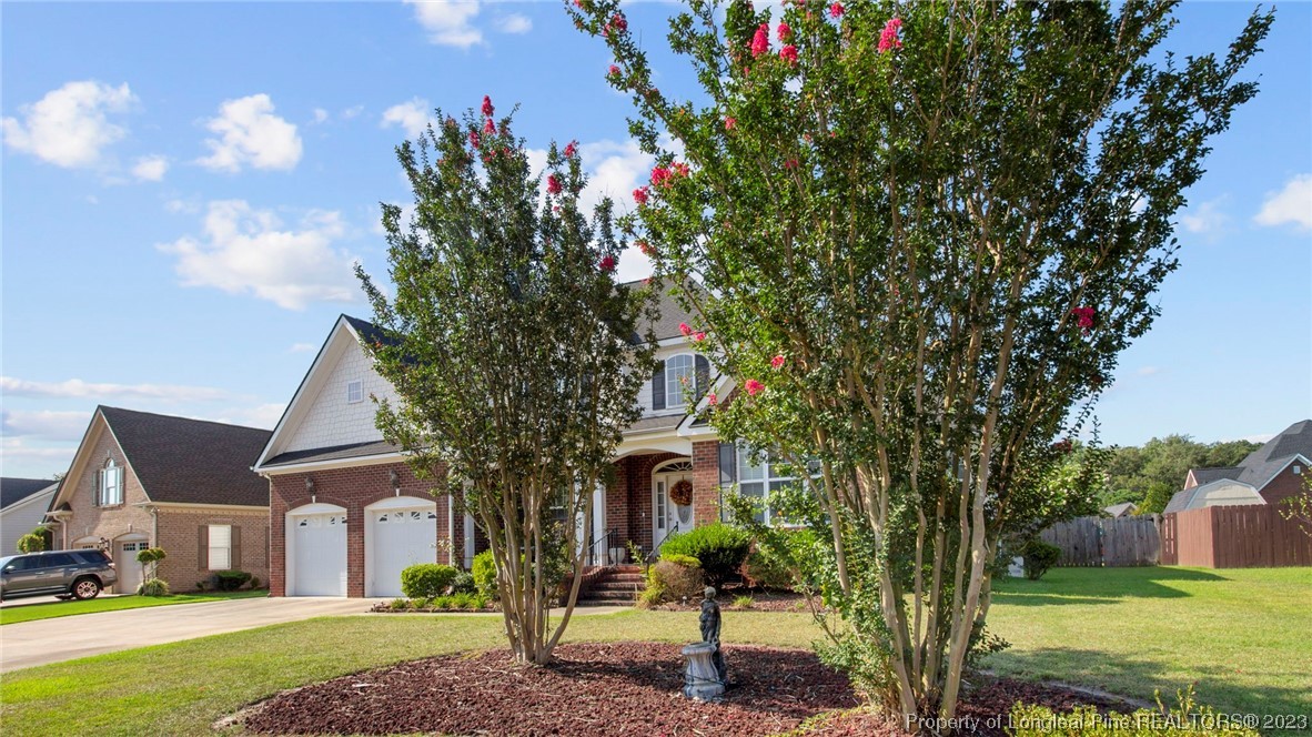 517 St Thomas Road Fayetteville, NC 28311 - Photo 2 of 47 a front view of a house with garden