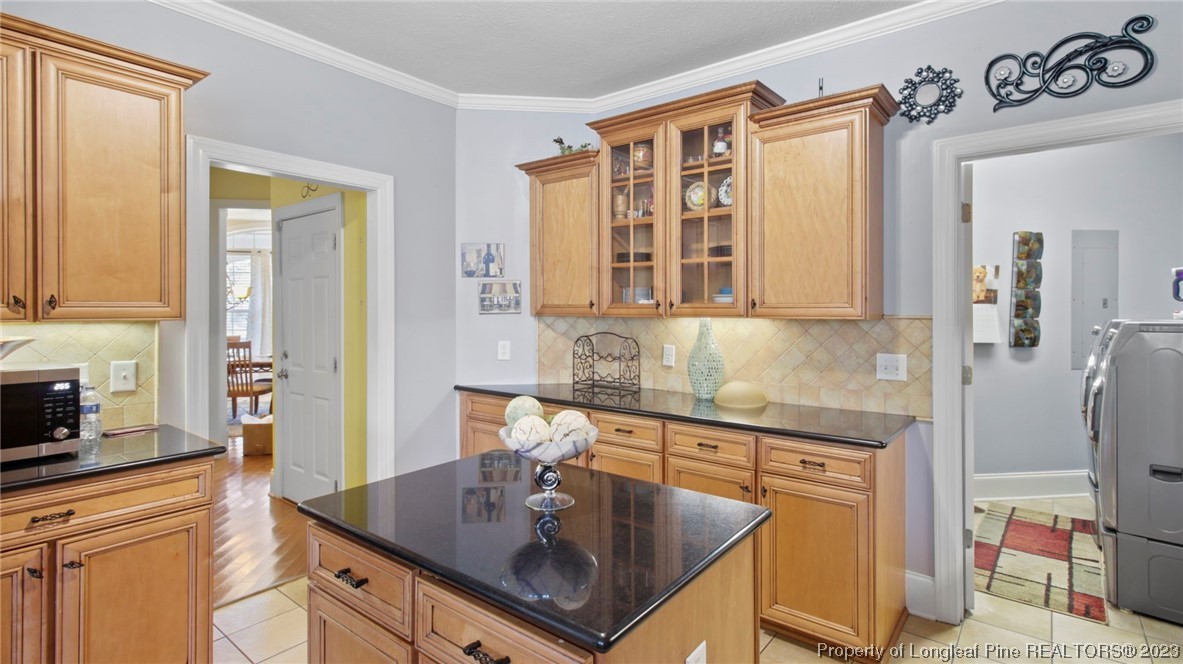 517 St Thomas Road Fayetteville, NC 28311 - Photo 23 of 47 a kitchen with stainless steel appliances granite countertop a sink stove and cabinets