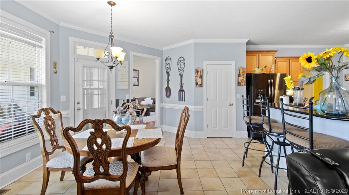 517 St Thomas Road Fayetteville, NC 28311 - Photo 27 of 47 a view of a dining room with furniture window and outside view