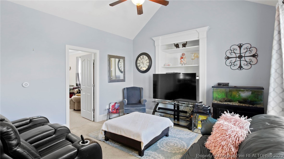 517 St Thomas Road Fayetteville, NC 28311 - Photo 28 of 47 a living room with furniture and a flat screen tv