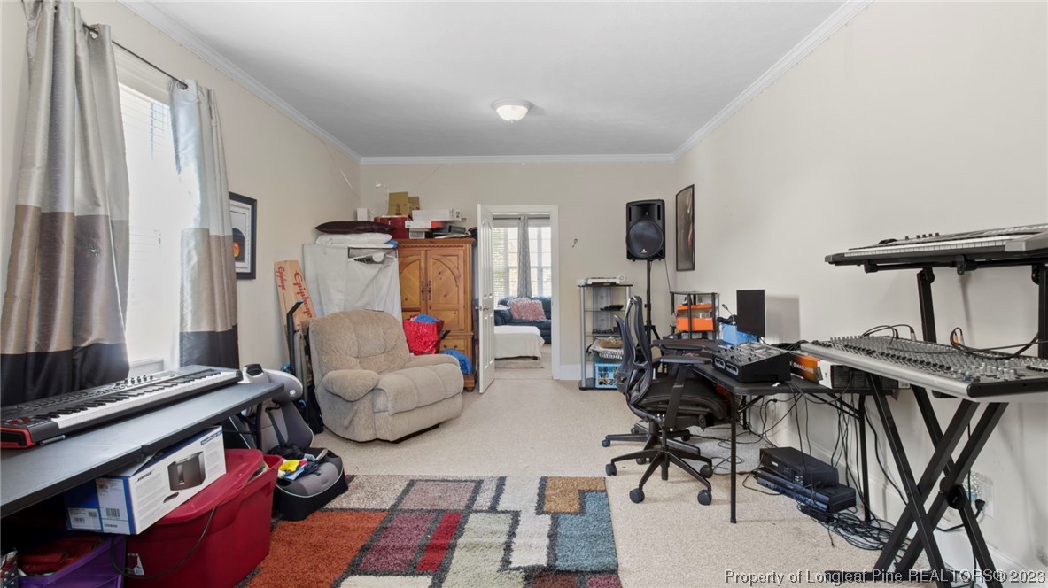517 St Thomas Road Fayetteville, NC 28311 - Photo 30 of 47 a living room with furniture and a flat screen tv