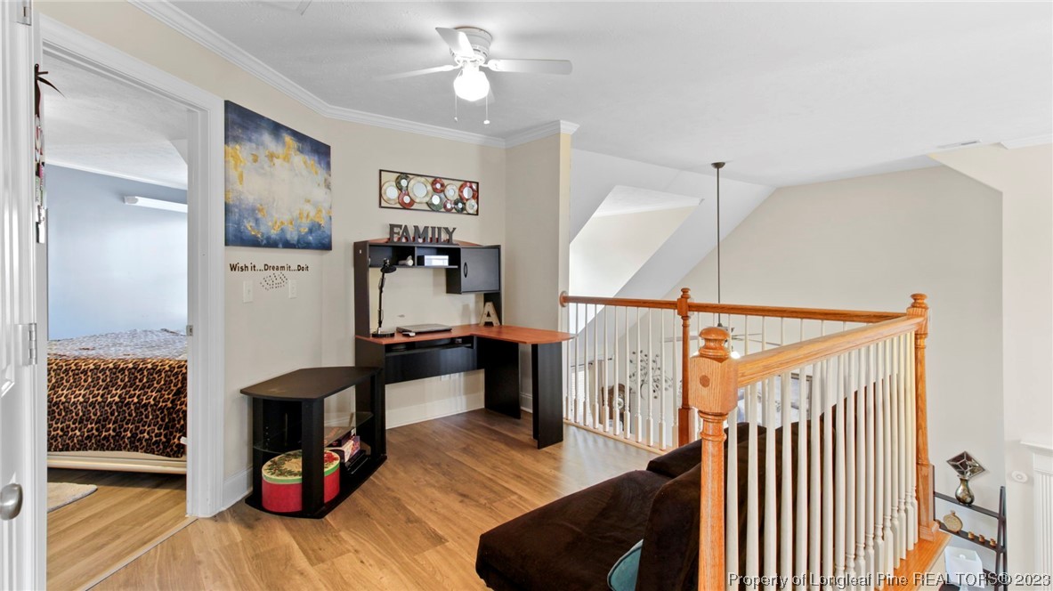 517 St Thomas Road Fayetteville, NC 28311 - Photo 31 of 47 a living room with furniture and wooden floor