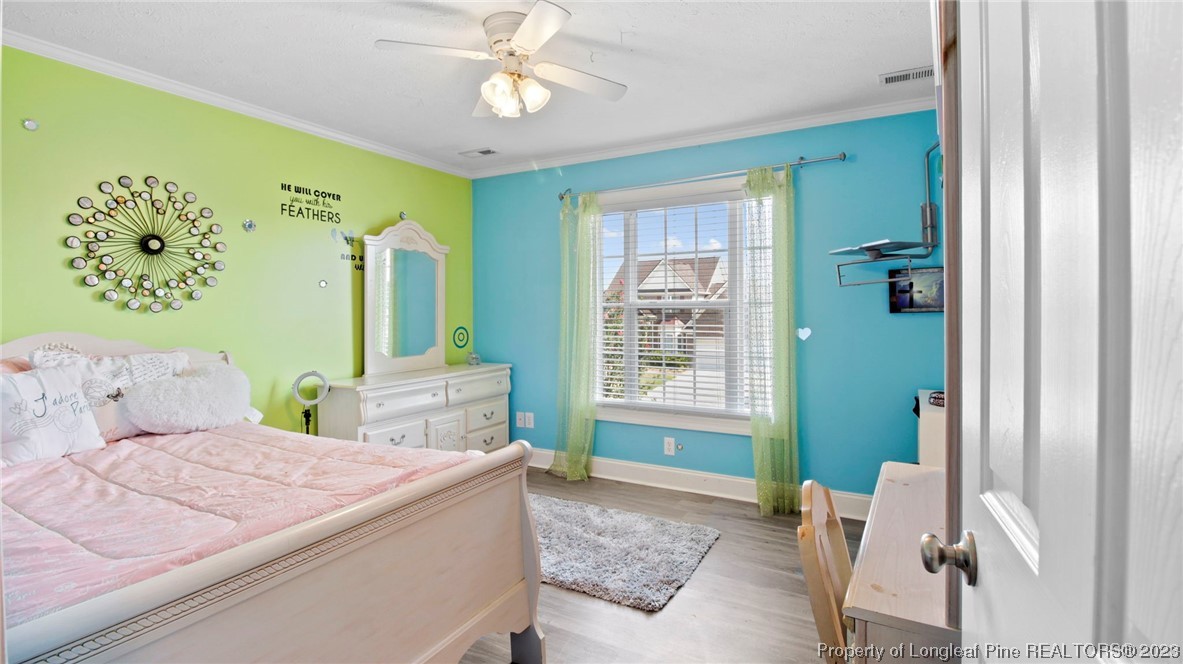 517 St Thomas Road Fayetteville, NC 28311 - Photo 32 of 47 a bedroom with a large bed and a window