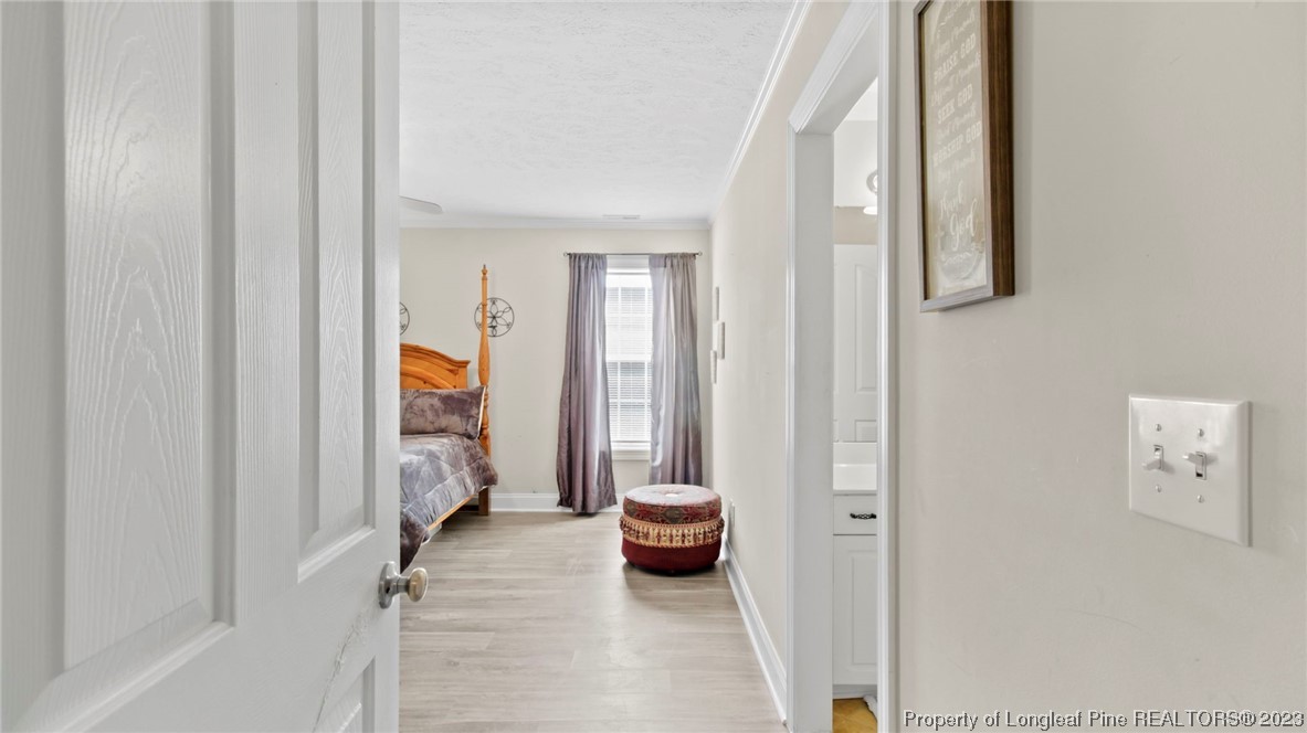 517 St Thomas Road Fayetteville, NC 28311 - Photo 40 of 47 a view of a hallway with outdoor seating