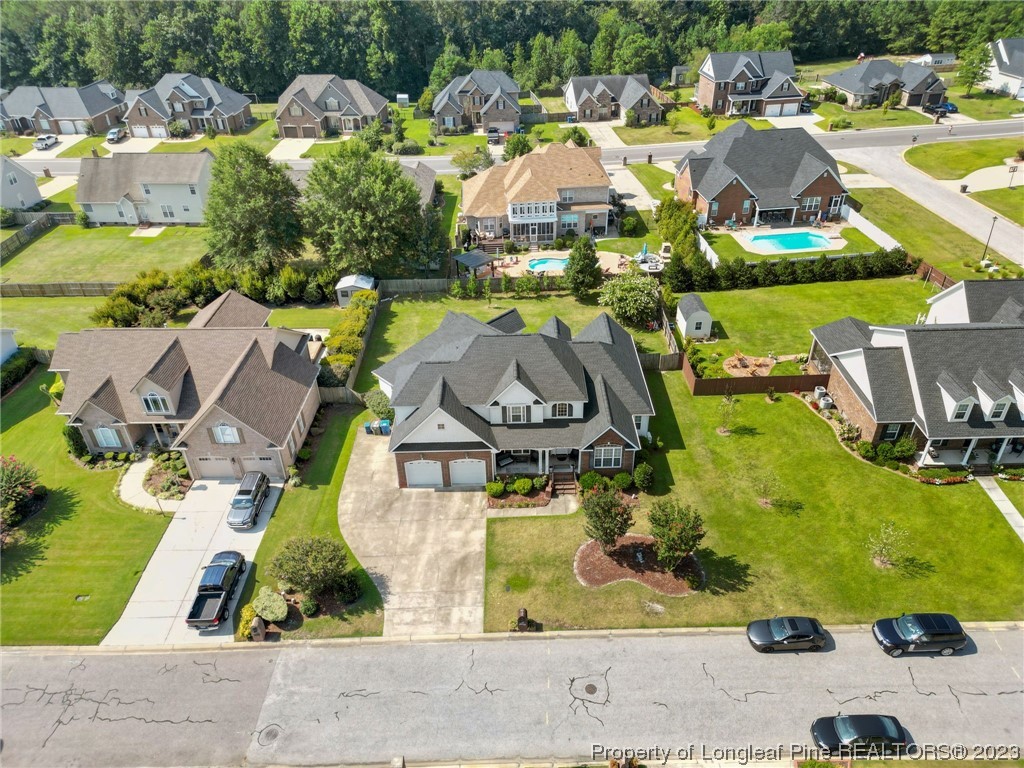 517 St Thomas Road Fayetteville, NC 28311 - Photo 4 of 47 an aerial view of residential houses with outdoor space and parking
