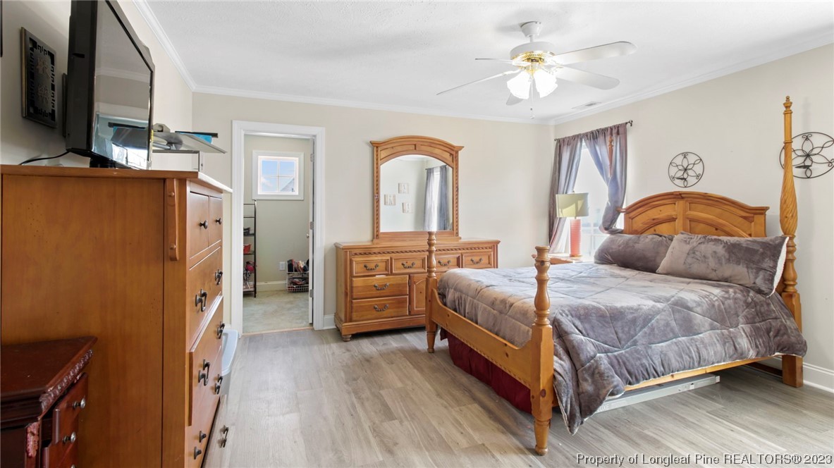 517 St Thomas Road Fayetteville, NC 28311 - Photo 41 of 47 a bedroom with a bed dresser and a flat tv screen