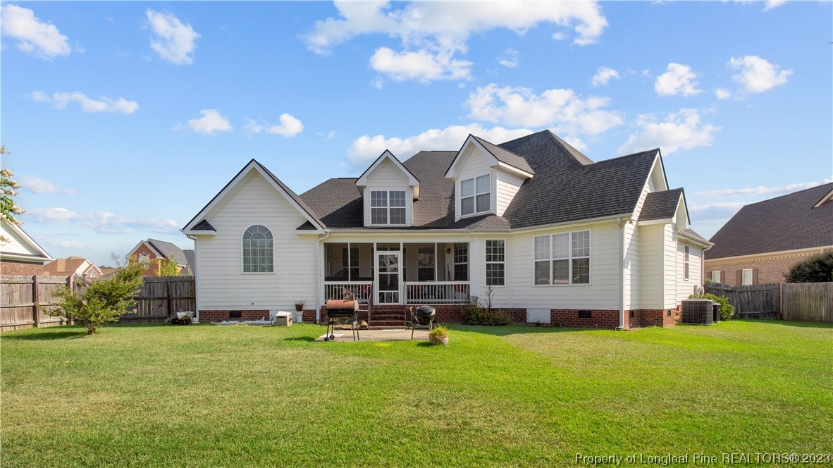 517 St Thomas Road Fayetteville, NC 28311 - Photo 45 of 47 a front view of a house with a yard table and chairs