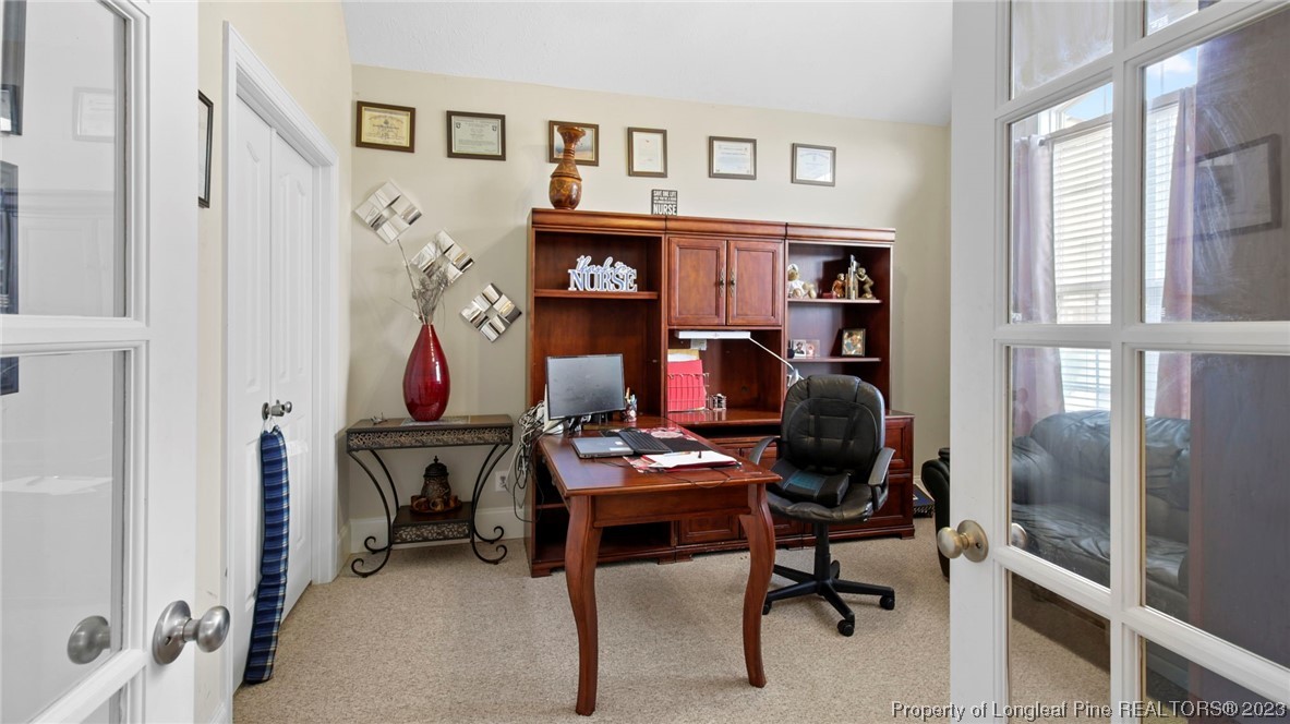 517 St Thomas Road Fayetteville, NC 28311 - Photo 10 of 47 a view of a workspace with furniture and a window