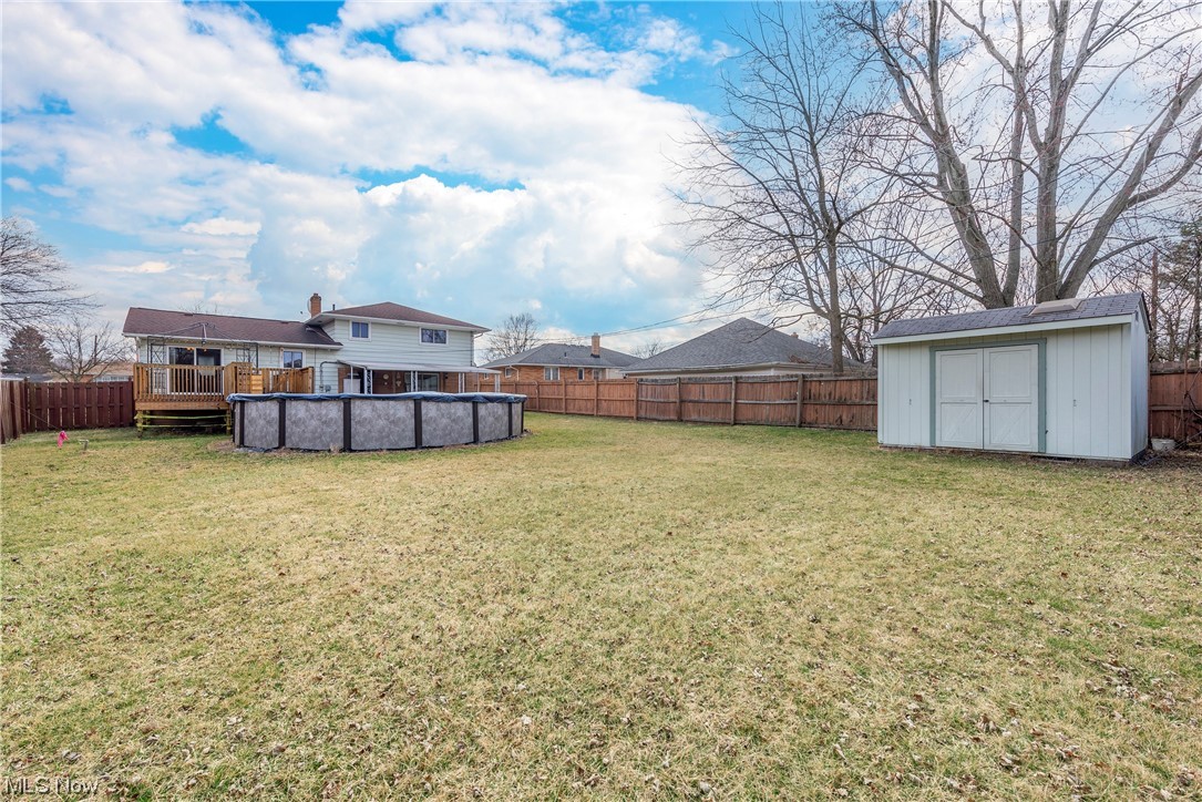 7094 Brandywine Road Parma Heights, OH 44130 - Photo 9 of 49 View of yard with a shed and a fenced in pool