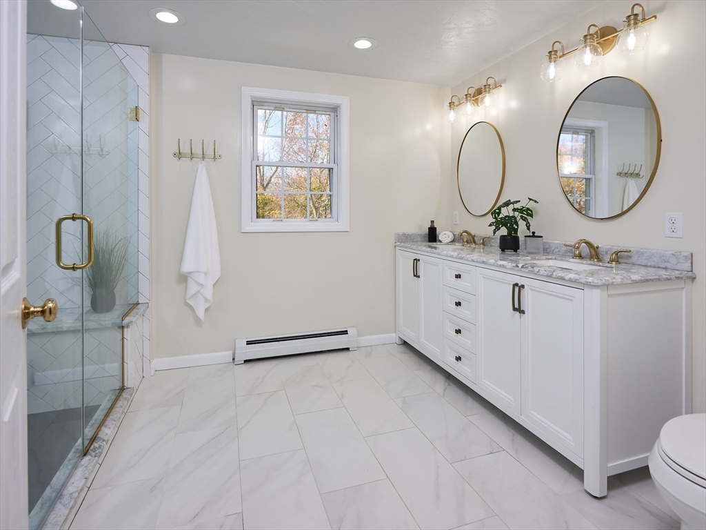 33 Wrentham Road Worcester, MA 01602 - Photo 21 of 42 a bathroom with a double vanity sink mirror and a mirror