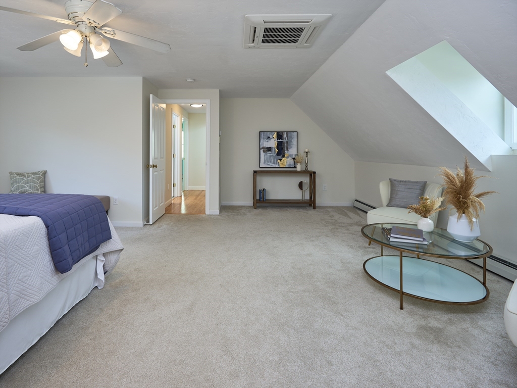 33 Wrentham Road Worcester, MA 01602 - Photo 23 of 42 a bedroom with furniture and a chandelier