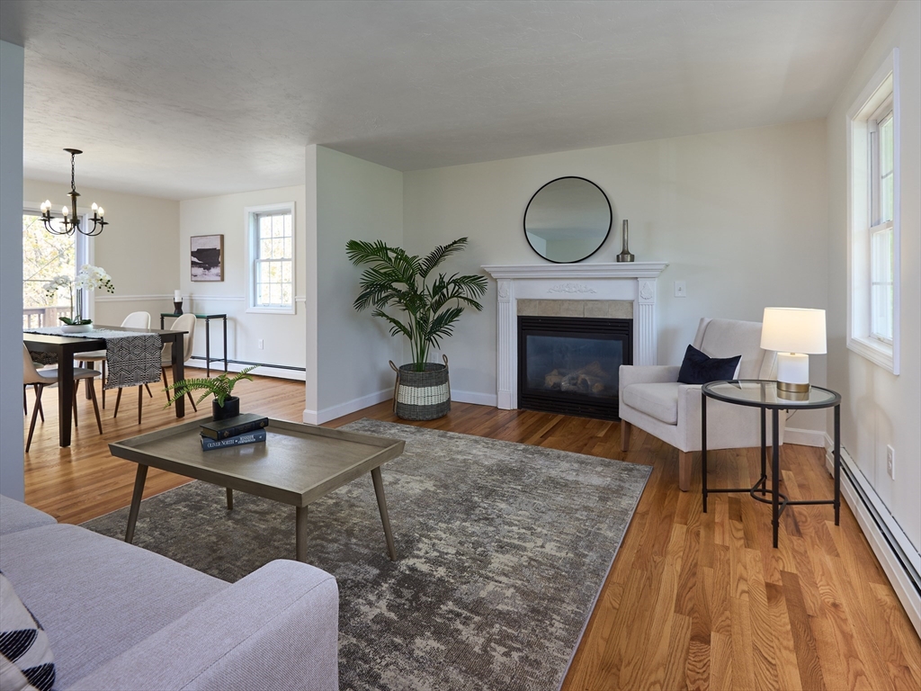 33 Wrentham Road Worcester, MA 01602 - Photo 4 of 42 a living room with furniture a fireplace and a potted plant