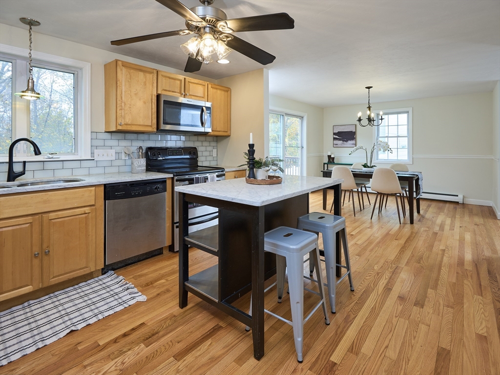 33 Wrentham Road Worcester, MA 01602 - Photo 9 of 42 a view of a dining room with furniture and wooden floor