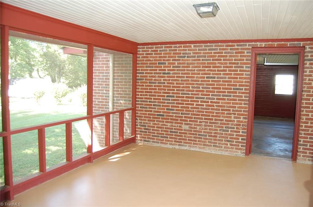 1114 Surry Line Road Pinnacle, NC 27043 - Photo 14 of 21 The wonderful screened porch is the perfect place to relax and watch the birds and wildlife. The door you see in the picture leads to the garage