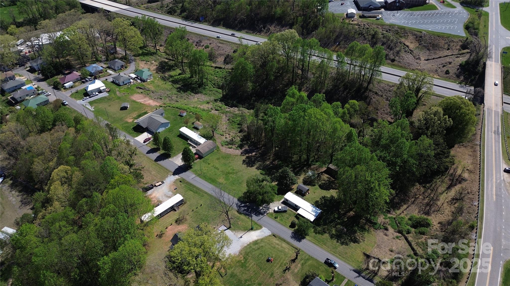 16 Hoyle Street, Unit 16 Marion, NC 28752 - Photo 5 of 5 an aerial view of a house with a yard