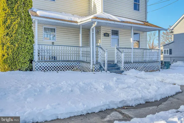 a view of a house with a fence